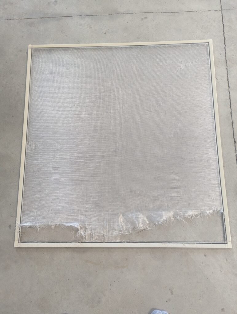 Very badly damaged window screen