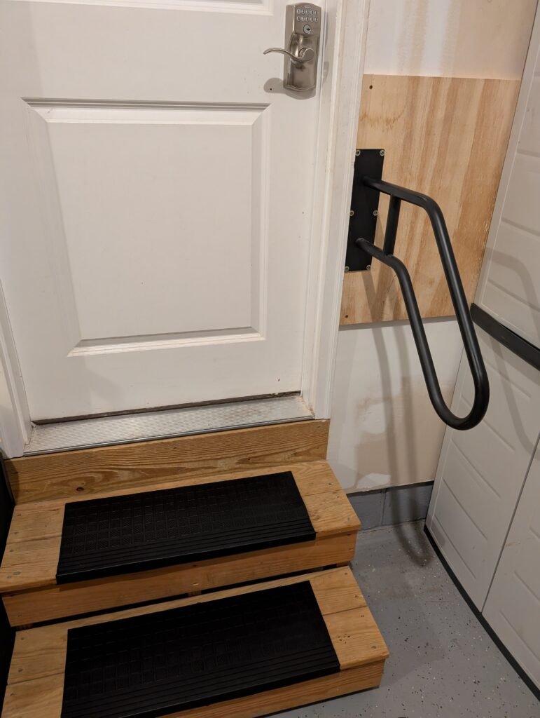 Non-slip treads and hand rail added